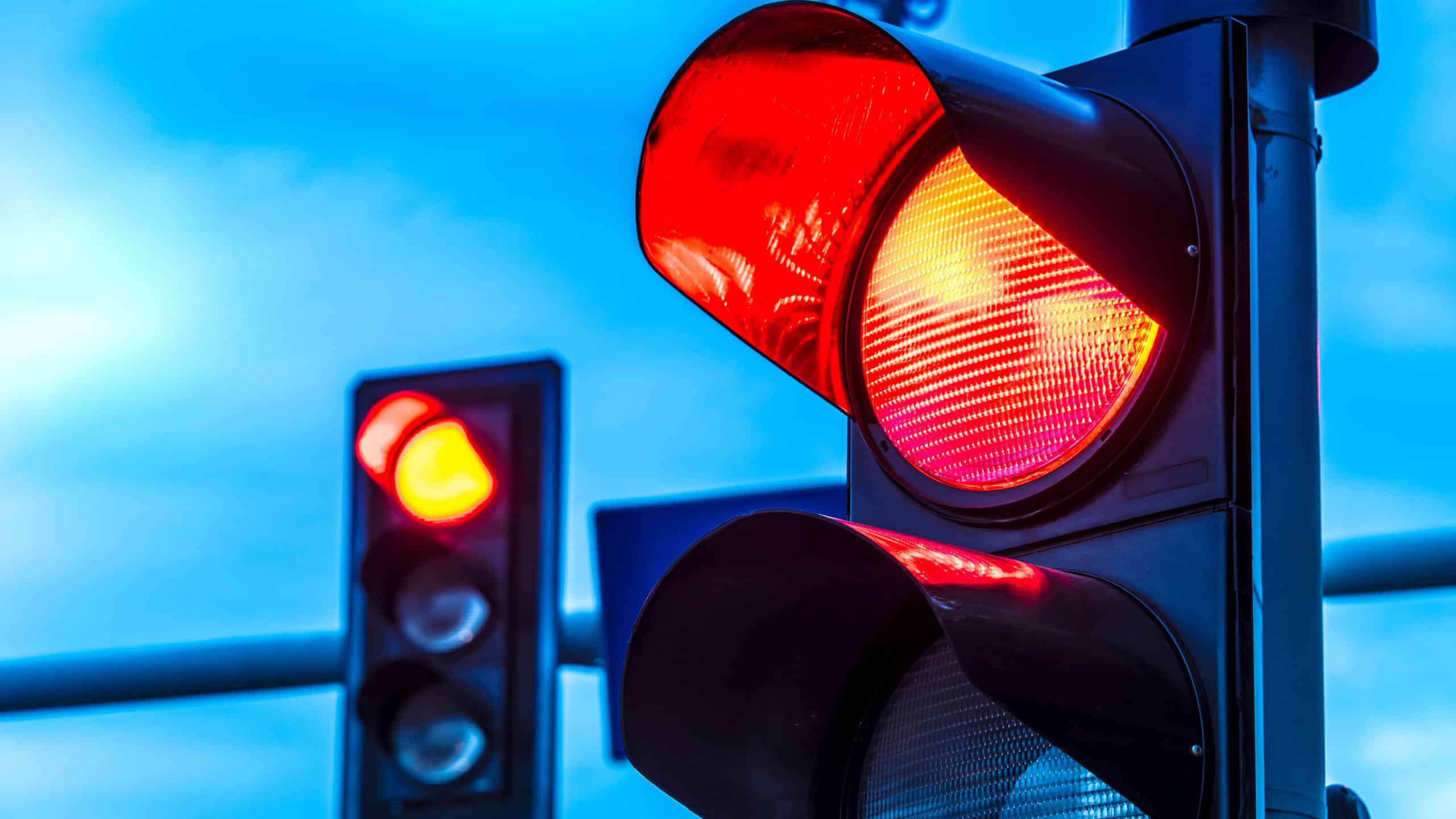 Traffic lights over urban intersection. Red light