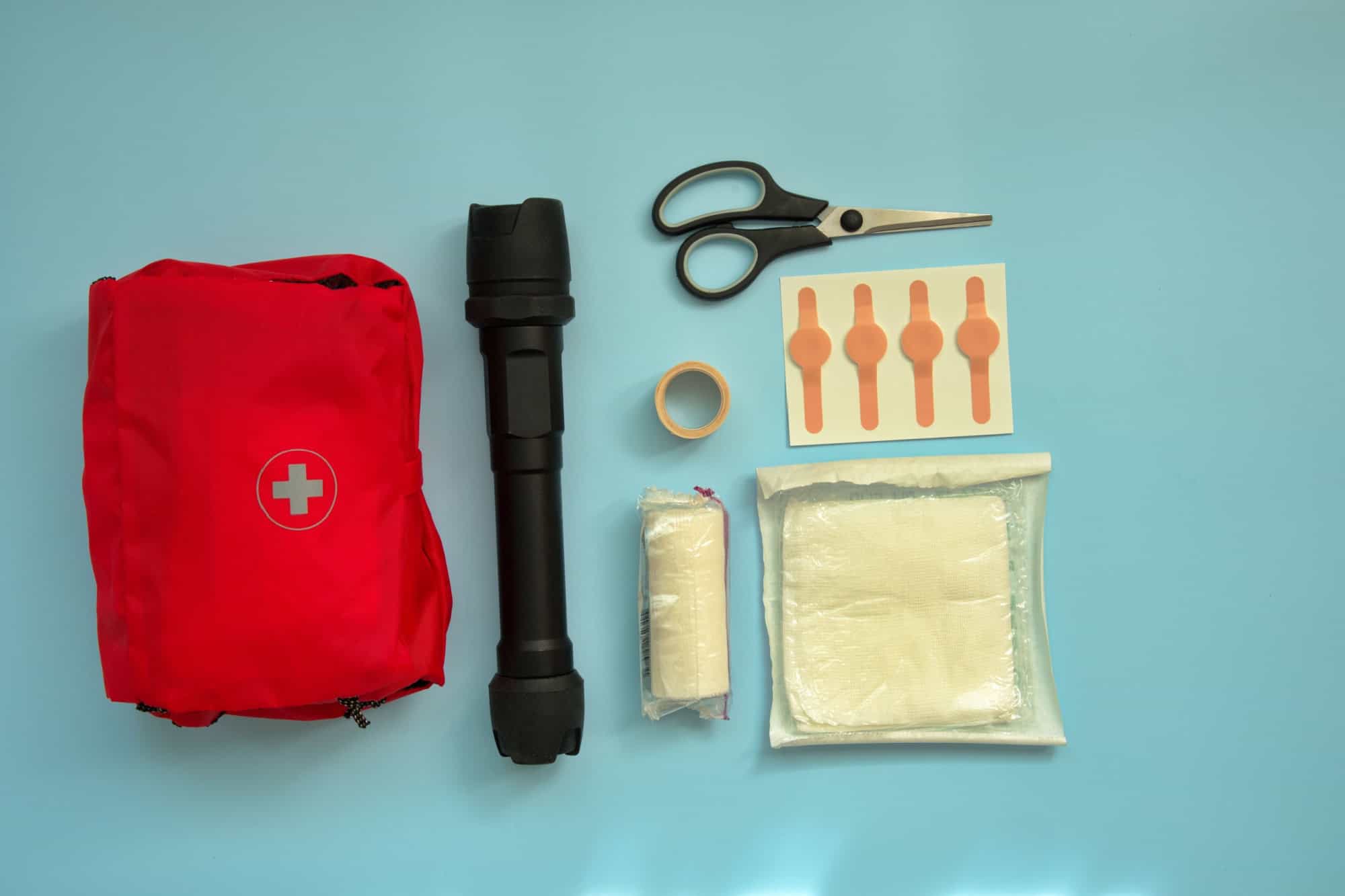 Directly above shot of first aid kit against blue background