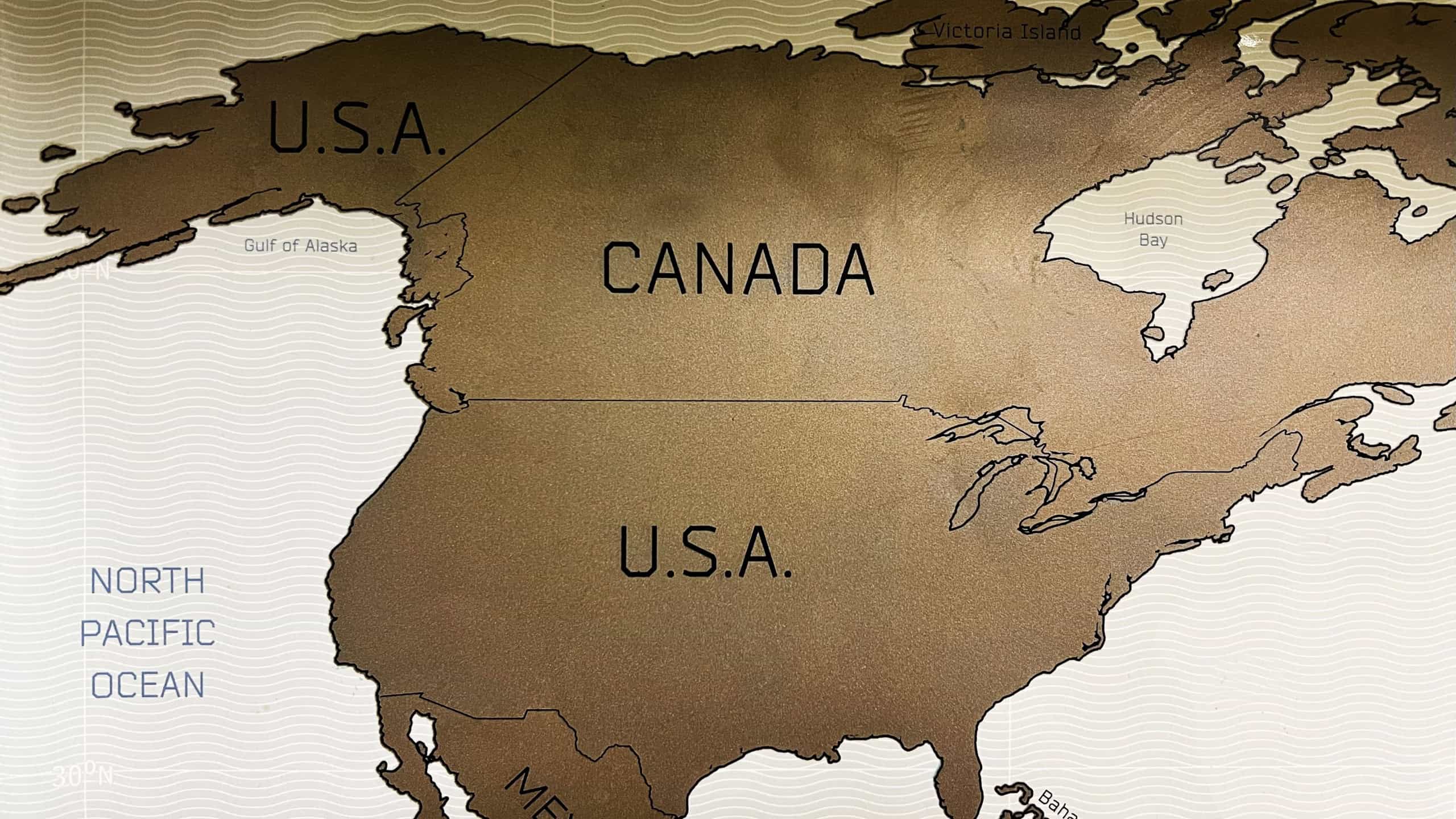 A detailed wall map illustrating the geographical territories of North America