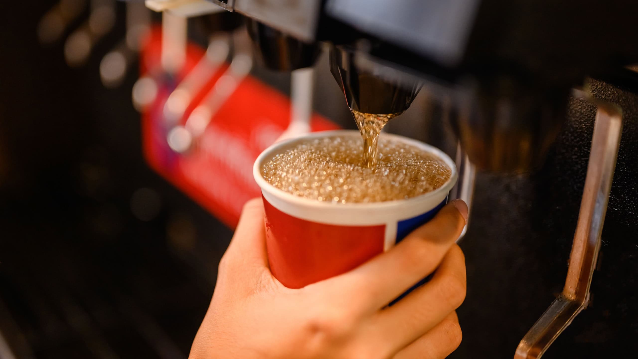 man pours a fizzy drink.sparkling water.cool ice soft drink cola