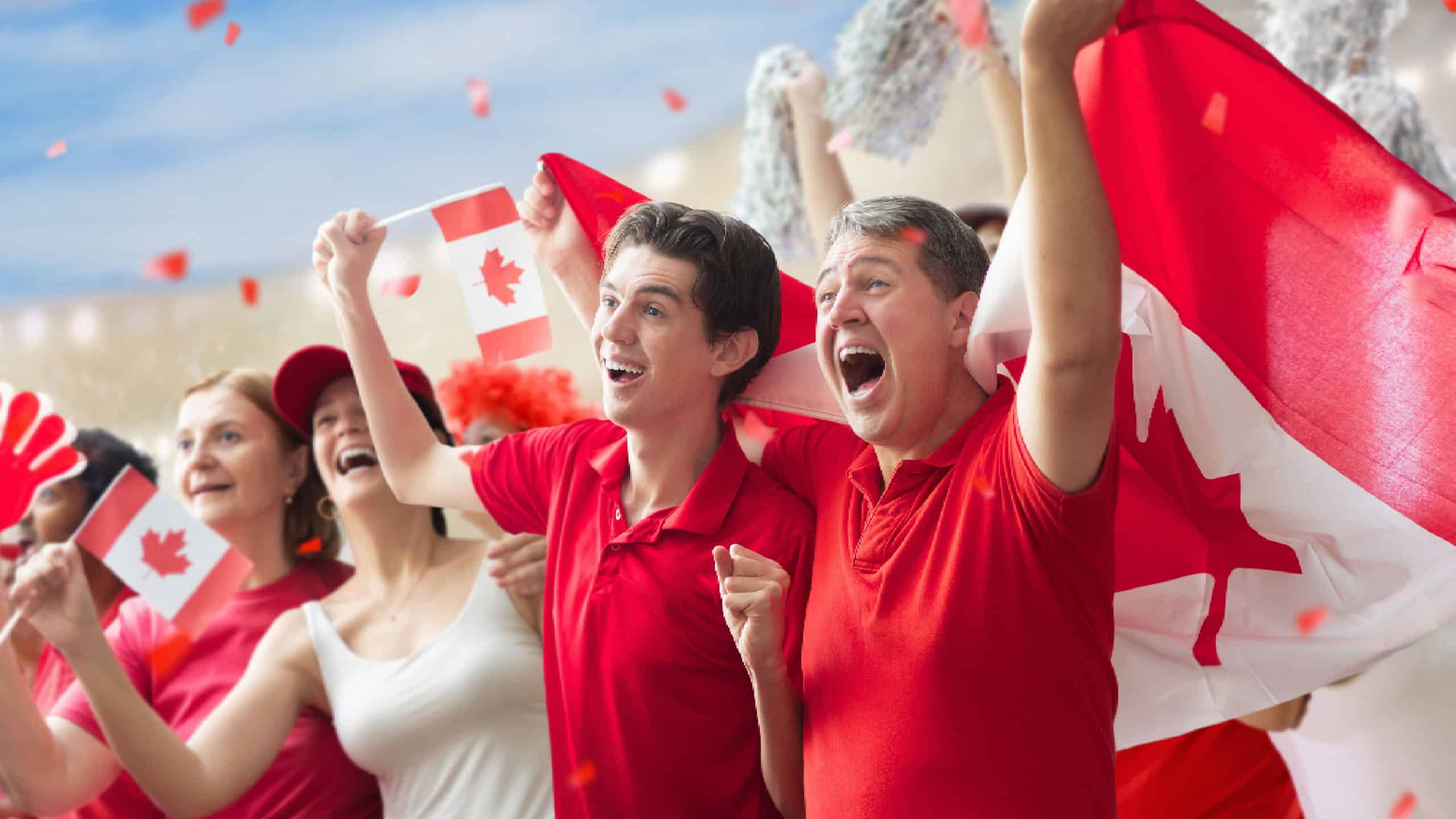 Canada hockey supporter on stadium. Canadian fans on hockey pitch watching team play. Group of supporters with flag and national jersey cheering for Canada. Championship game.