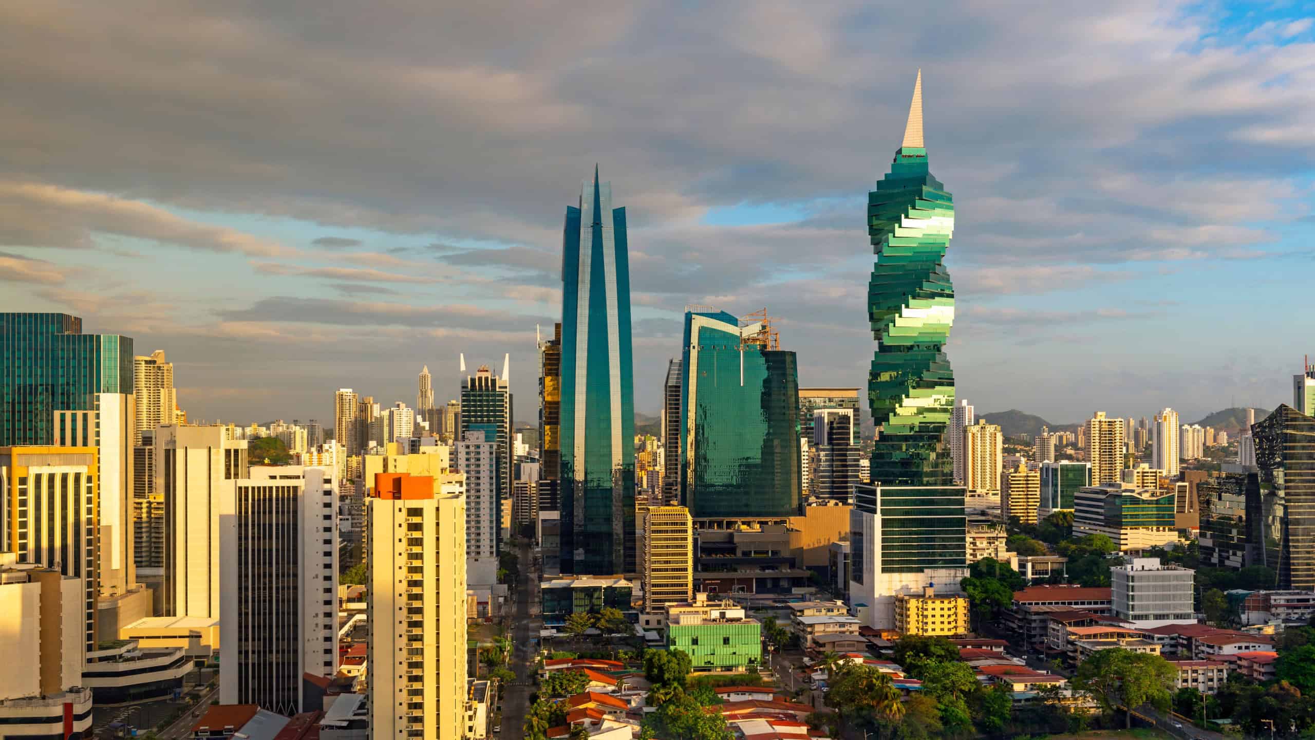 The colorful panoramic skyline of Panama City at sunset with high rise skyscrapers, Panama, Central America.