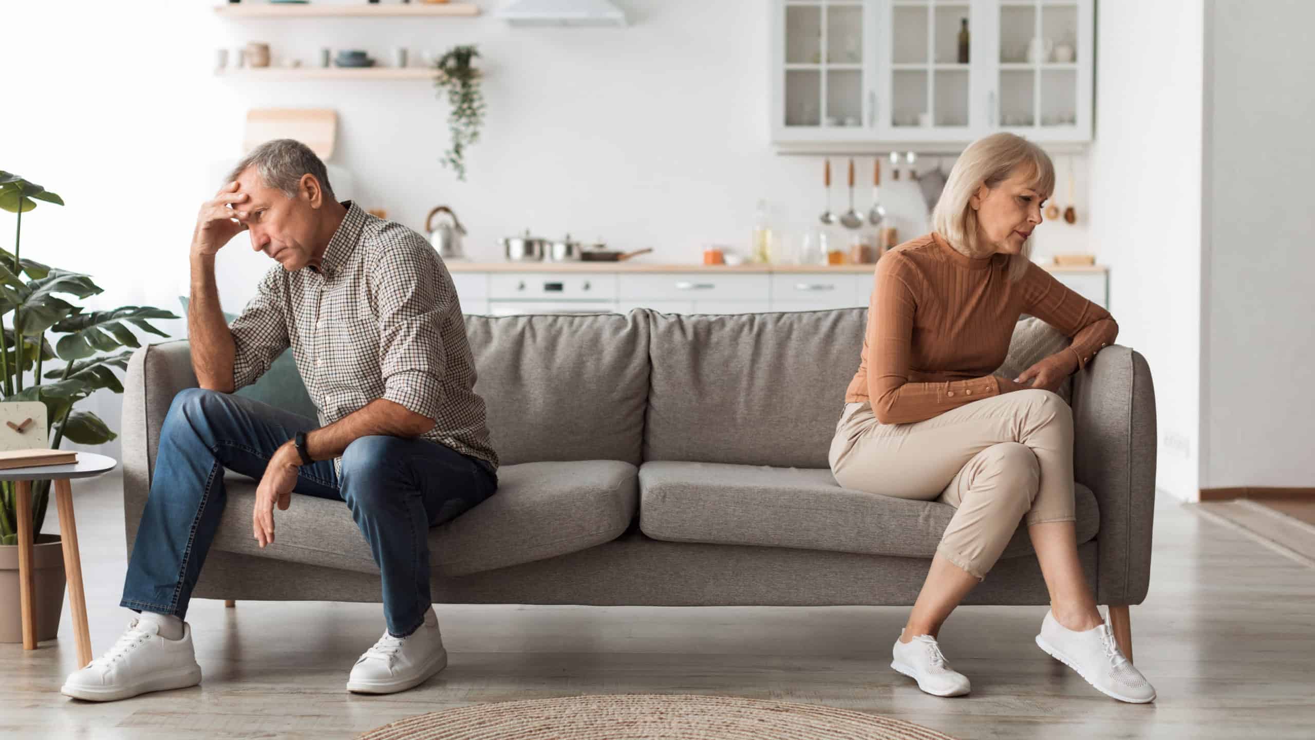 Unhappy Senior Couple Not Speaking After Quarrel Thinking About Divroce Sitting Back-To-Back, Experiencing Marital Crisis In Relationship At Home. Spouses Having Comunication Issues