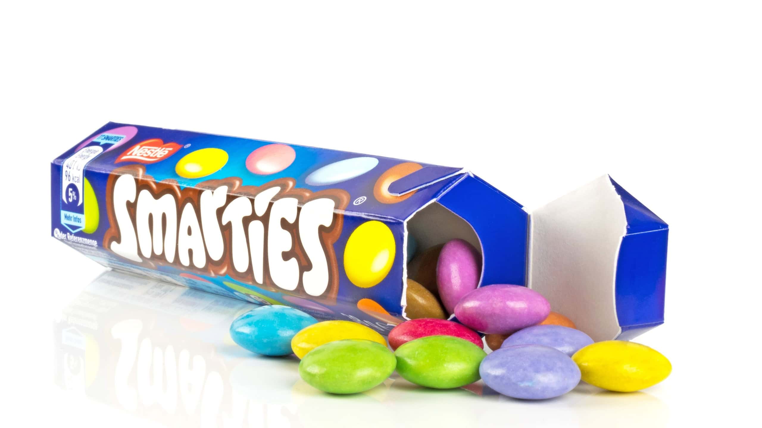 NIEDERSACHSEN, GERMANY SEPTEMBER 25, 2018: A tube of Nestle Smarties chocolate sweets on a white background