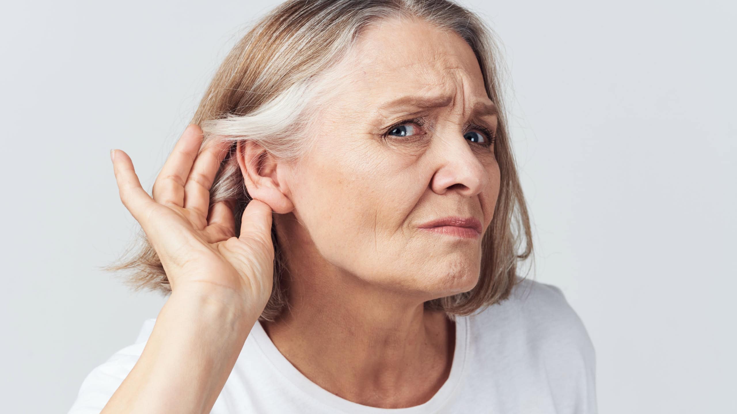Elderly woman hearing problems ear membranes