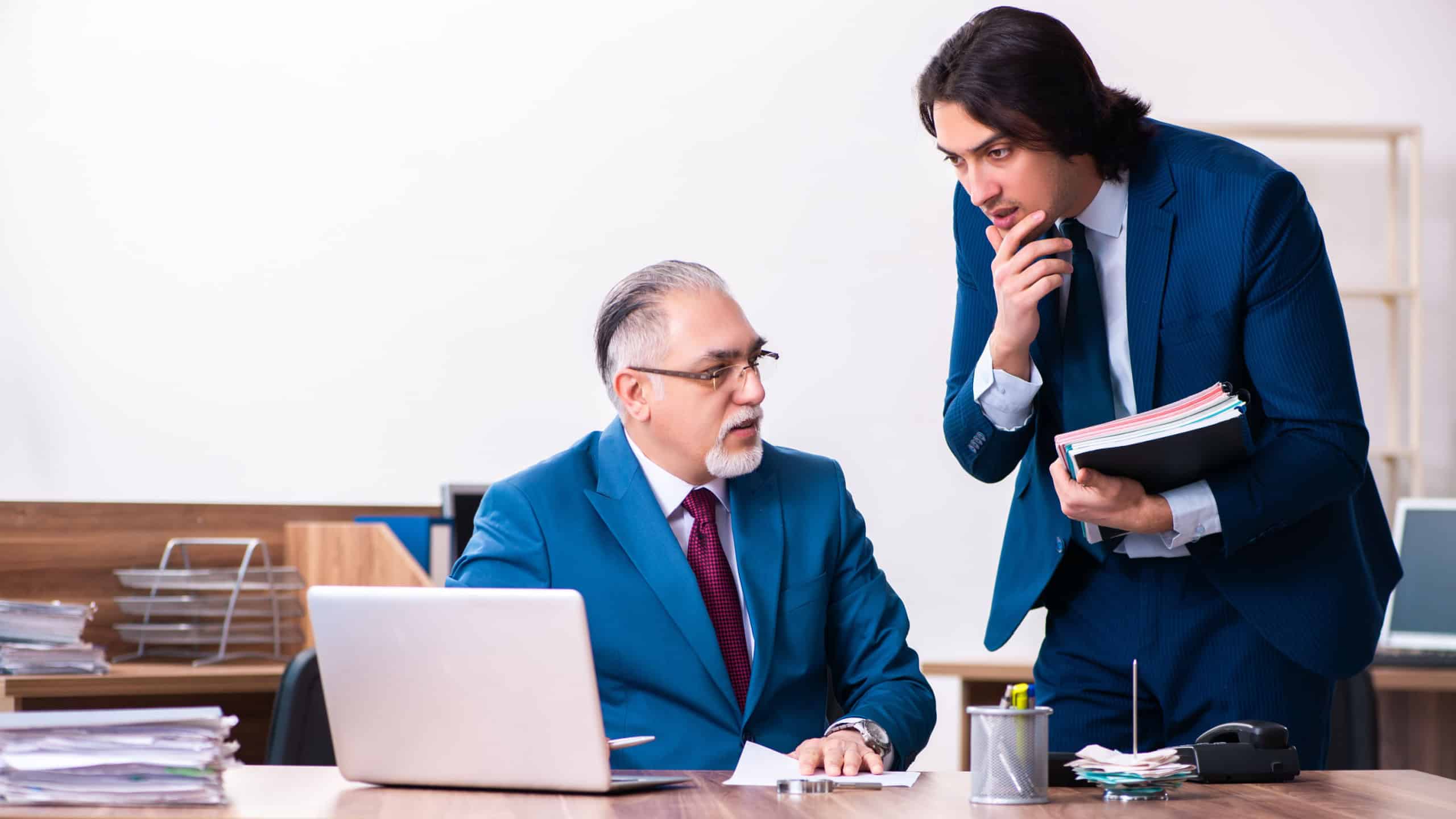 Young and old employees working together in the office