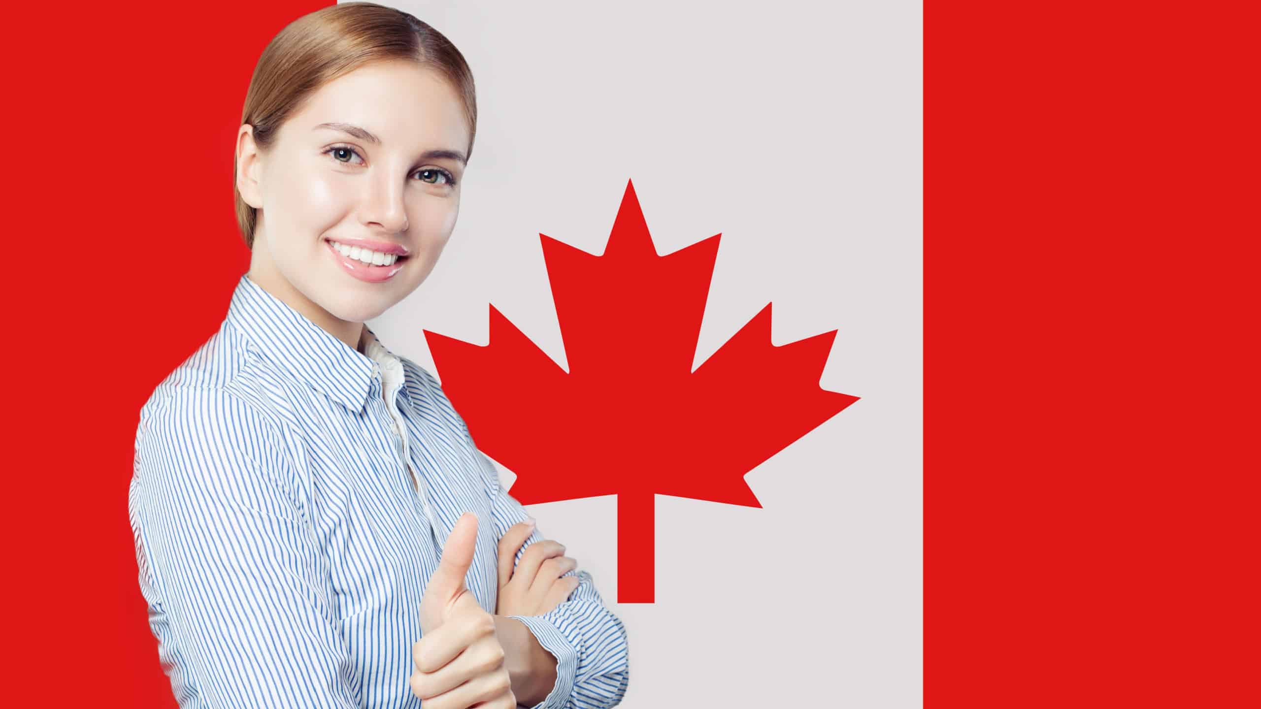 Cute young woman showing thumb up against the Canada flag. Live, work, education and internship in Canada