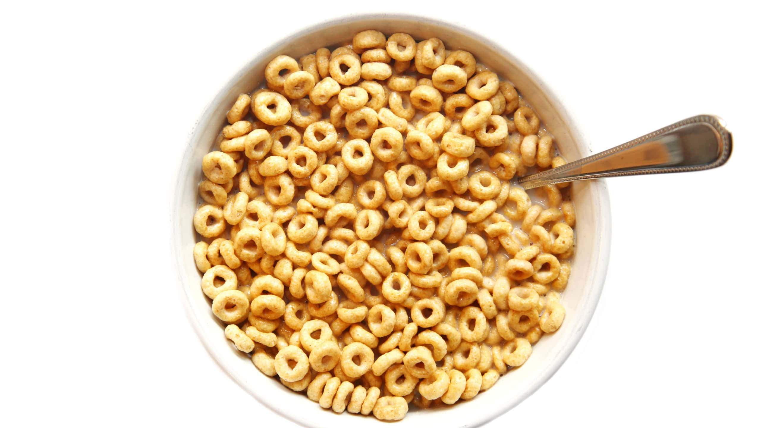 cheerios. Cereal in a bowl of milk. Breakfast food. Isolated on white. Room for text. 