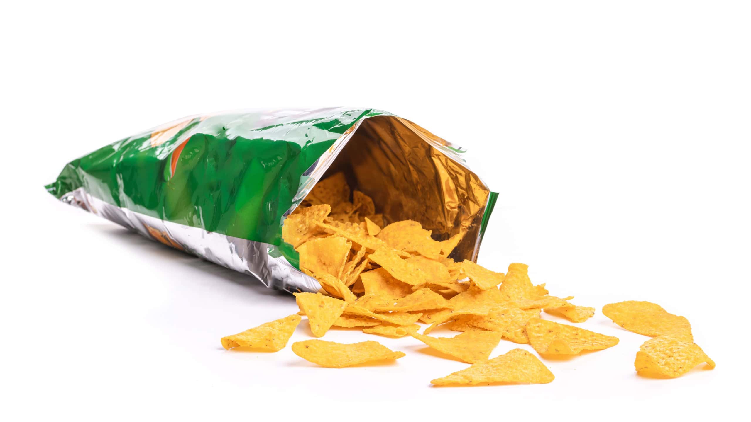 Heap of open packages and corn chips on a white background
