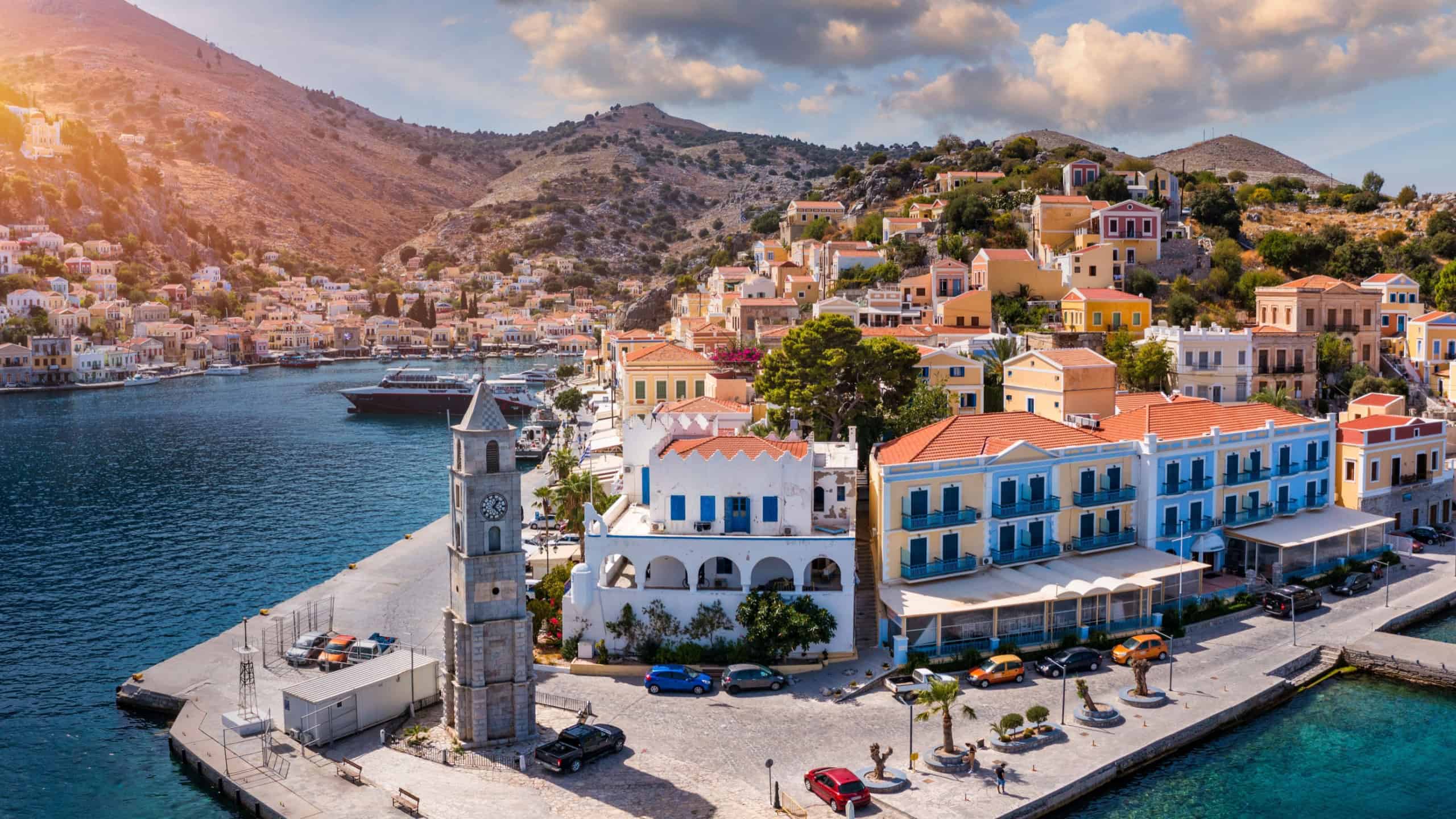 Aerial view of the beautiful greek island of Symi (Simi) with colourful houses and small boats. Greece, Symi island, view of the town of Symi (near Rhodes), Dodecanese.