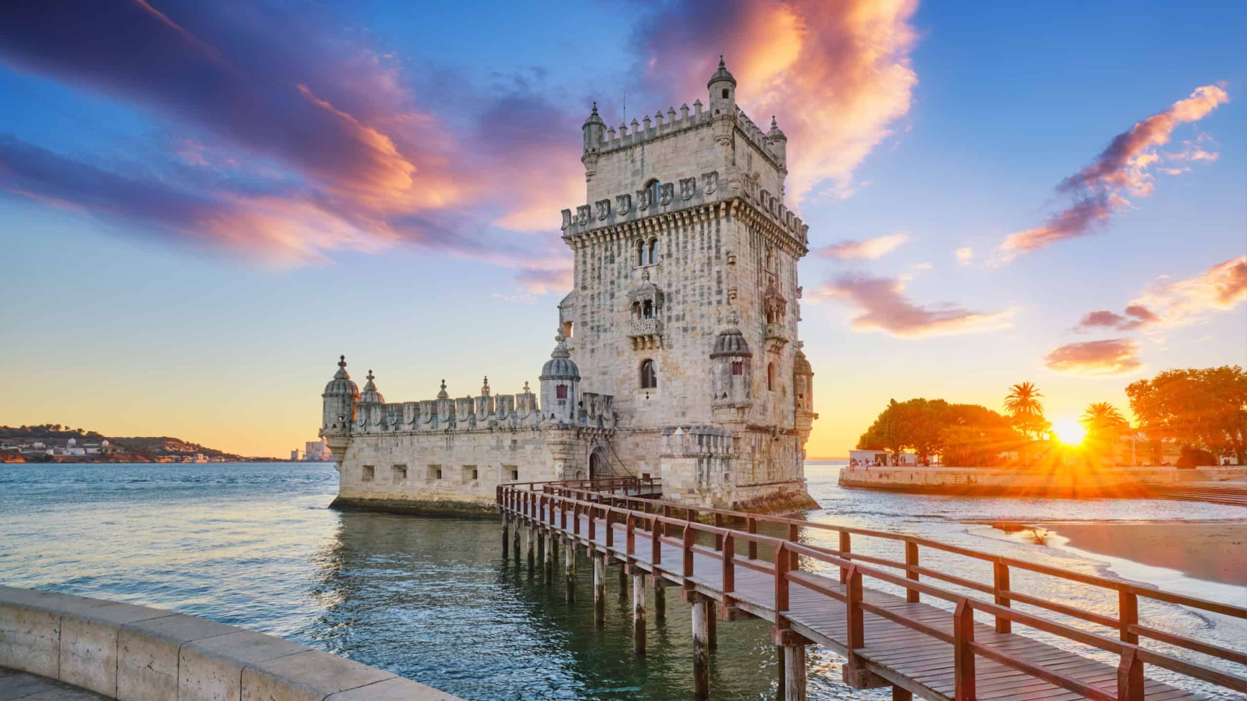 Belem Tower or Tower of St Vincent - famous tourist landmark of Lisboa and tourism attraction - on the bank of the Tagus River (Tejo) on sunset. Lisbon, Portugal