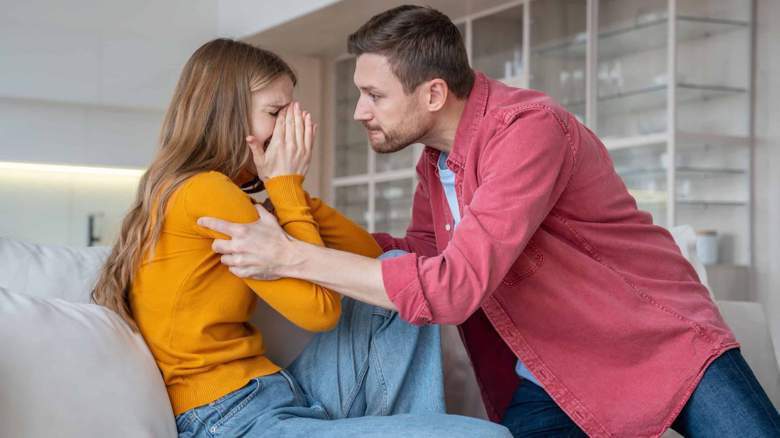 Man tyrant husband beating crying wife during scandal misunderstanding at home. Stressed mad abuser mocks the victim. Domestic physical emotional violence, toxic relationship, marital discord concept.