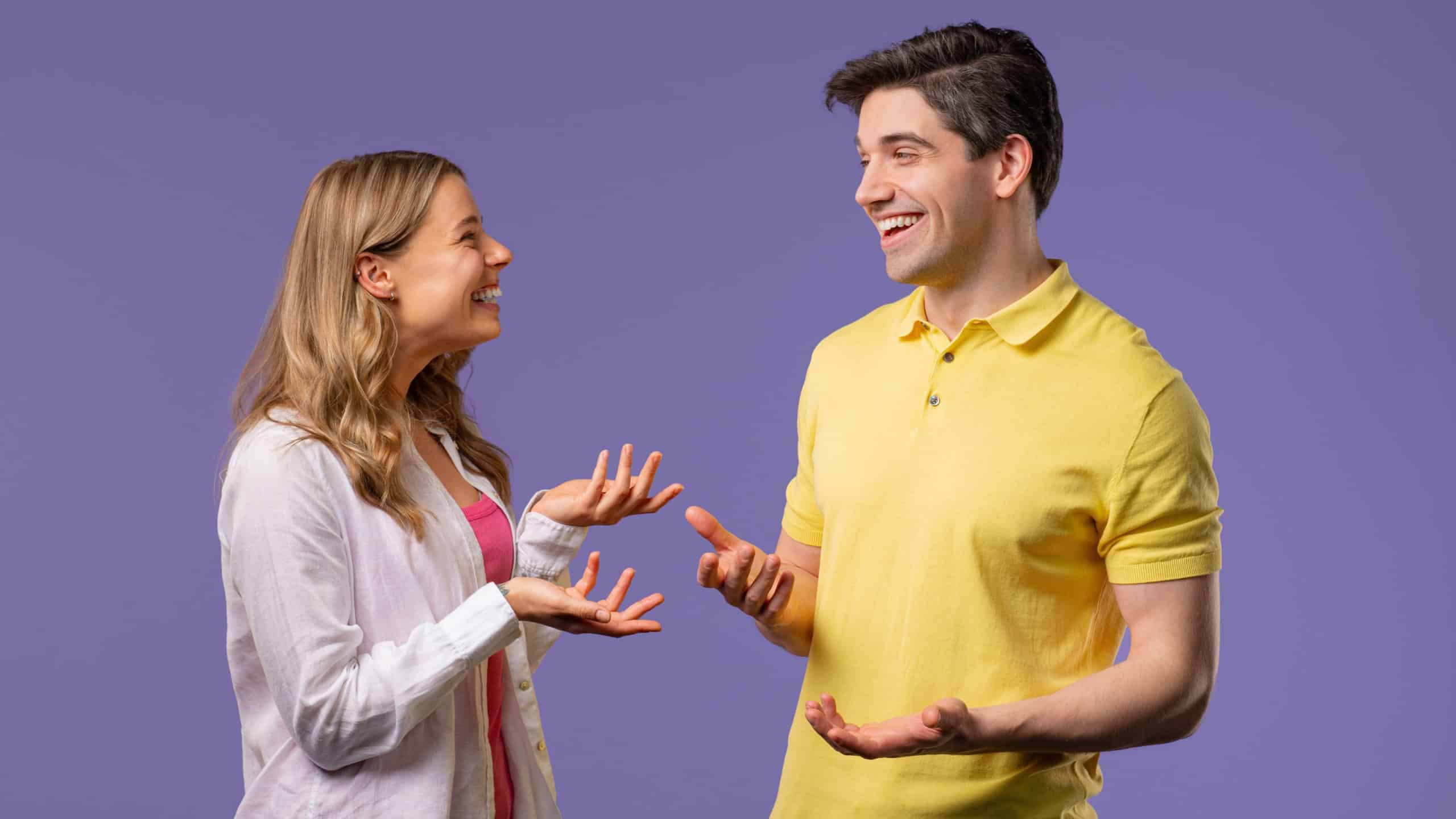 Young man woman friends nice talking together, small talk. Friends or young couple smiles, share news, information. High quality