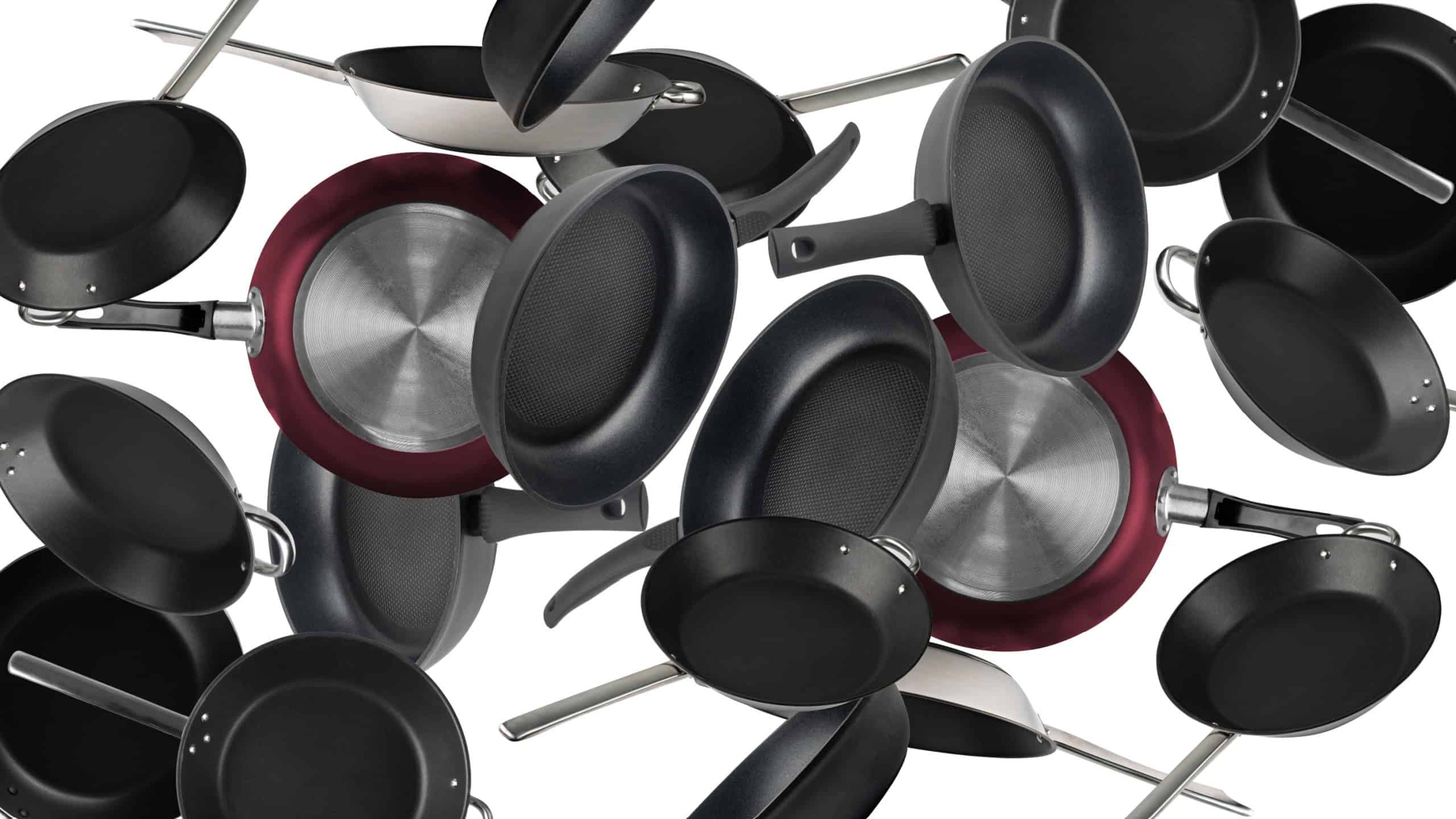 Flying Frying Pan Isolated, Falling New Empty Black Nonstick Cookware with Metal Handles, Frying Pan on White Background