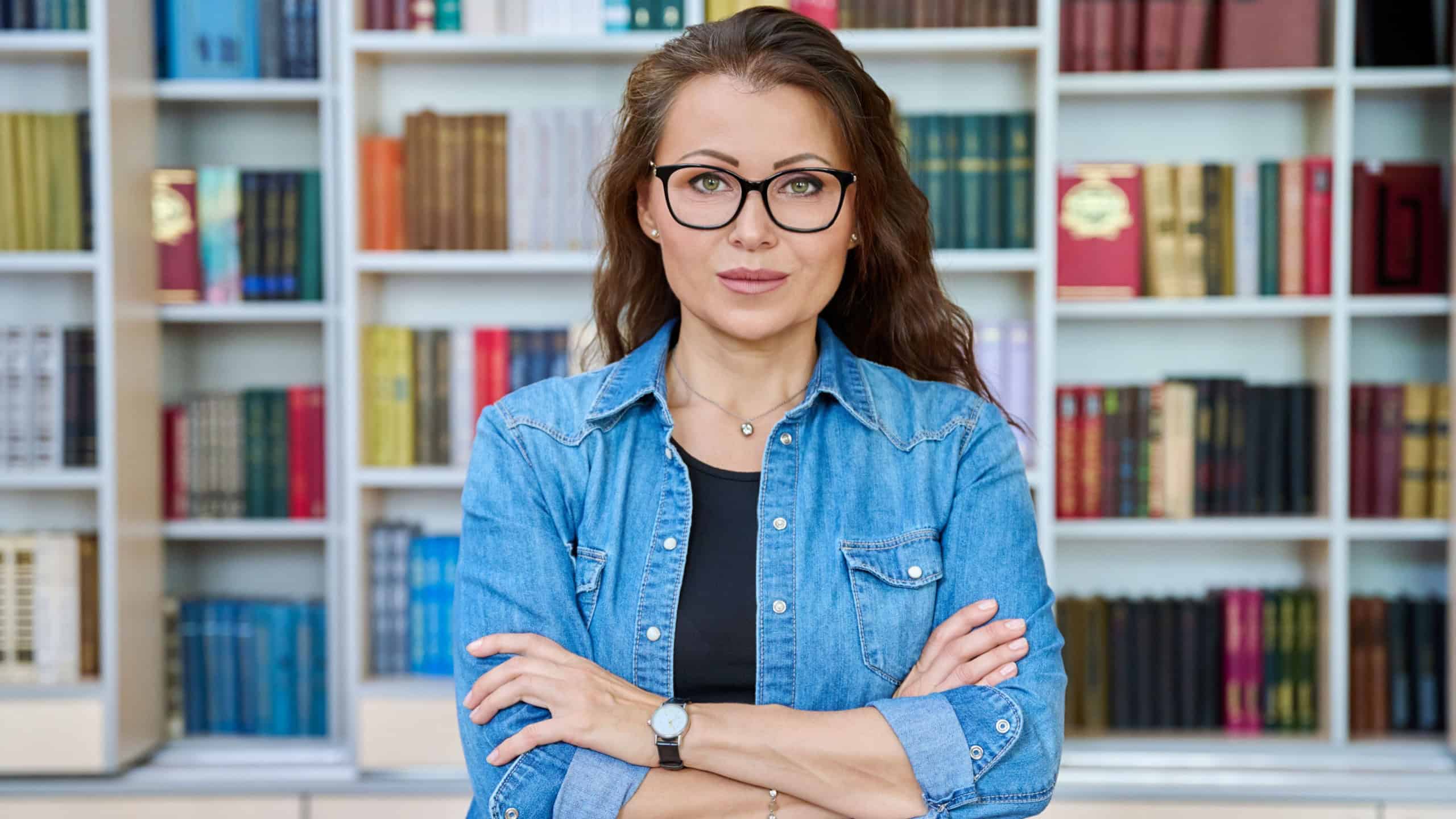 Portrait confident mature woman teacher, educational behavioral specialist in classroom