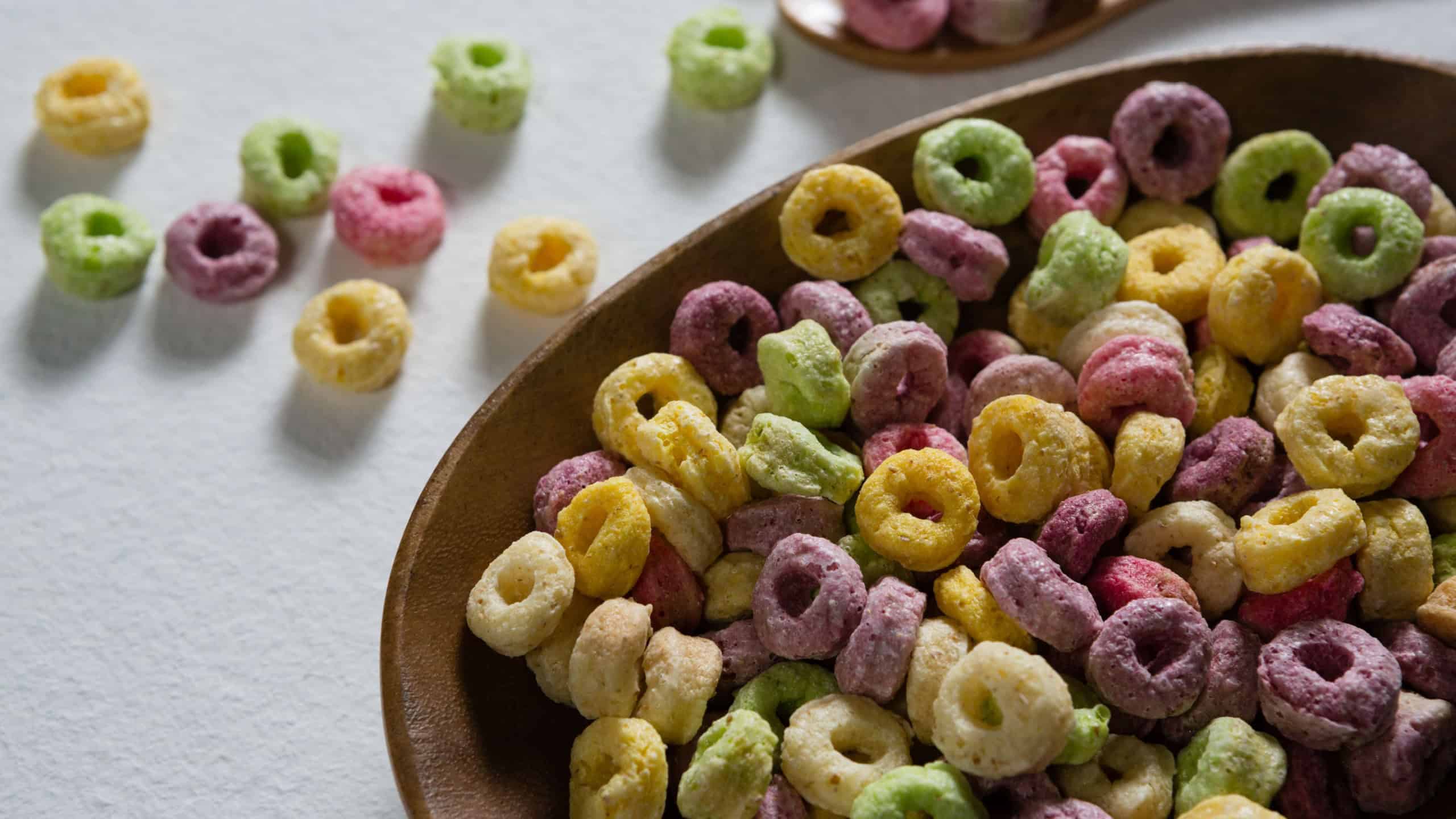 Froot loops in plate on white background