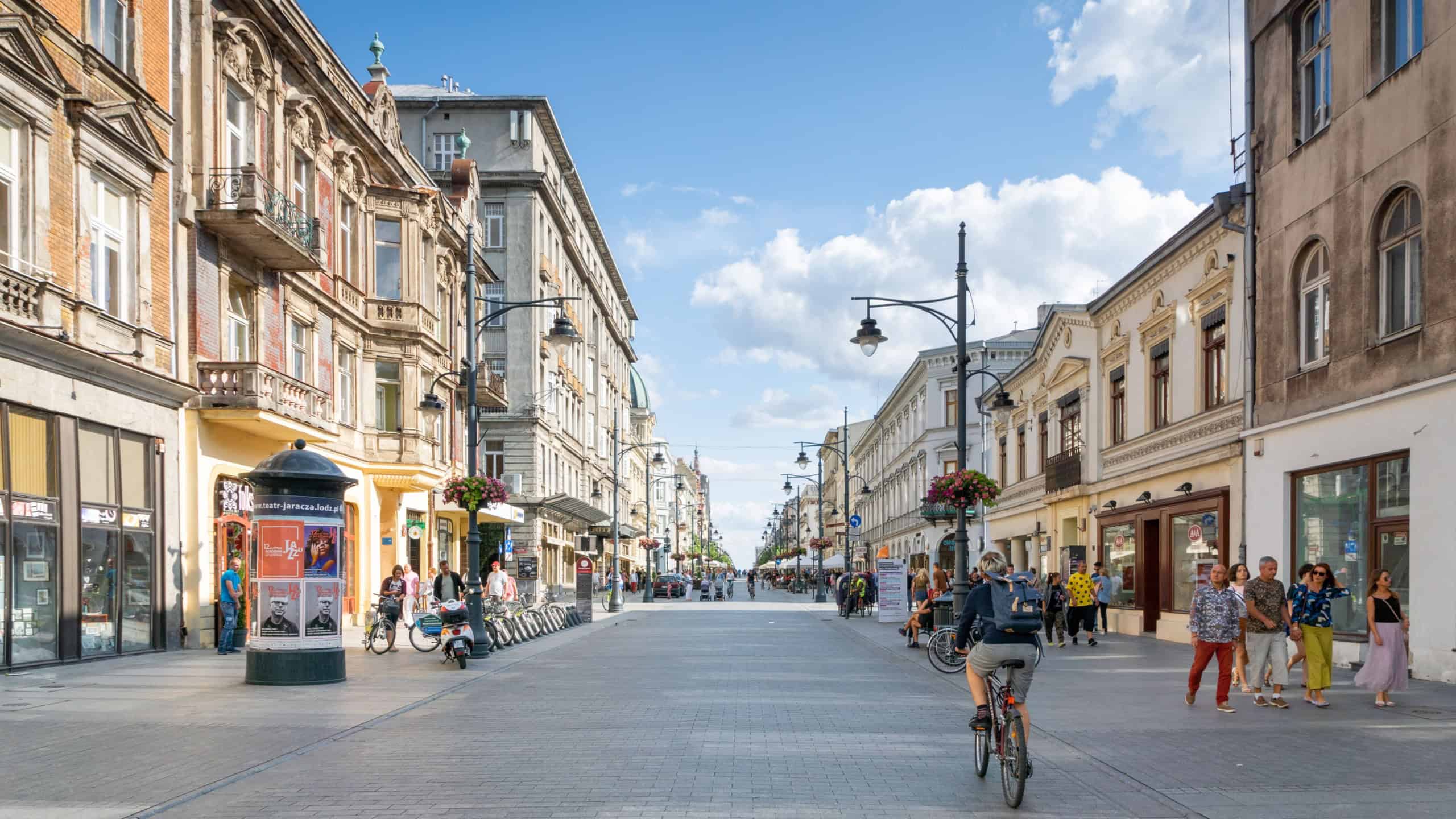 Lodz, Poland - July 2019: People and view of Piotrkowska Street in Lodz city central area. Piotrkowska Street in Łódź, Poland, is one of the longest commercial street in Europe.