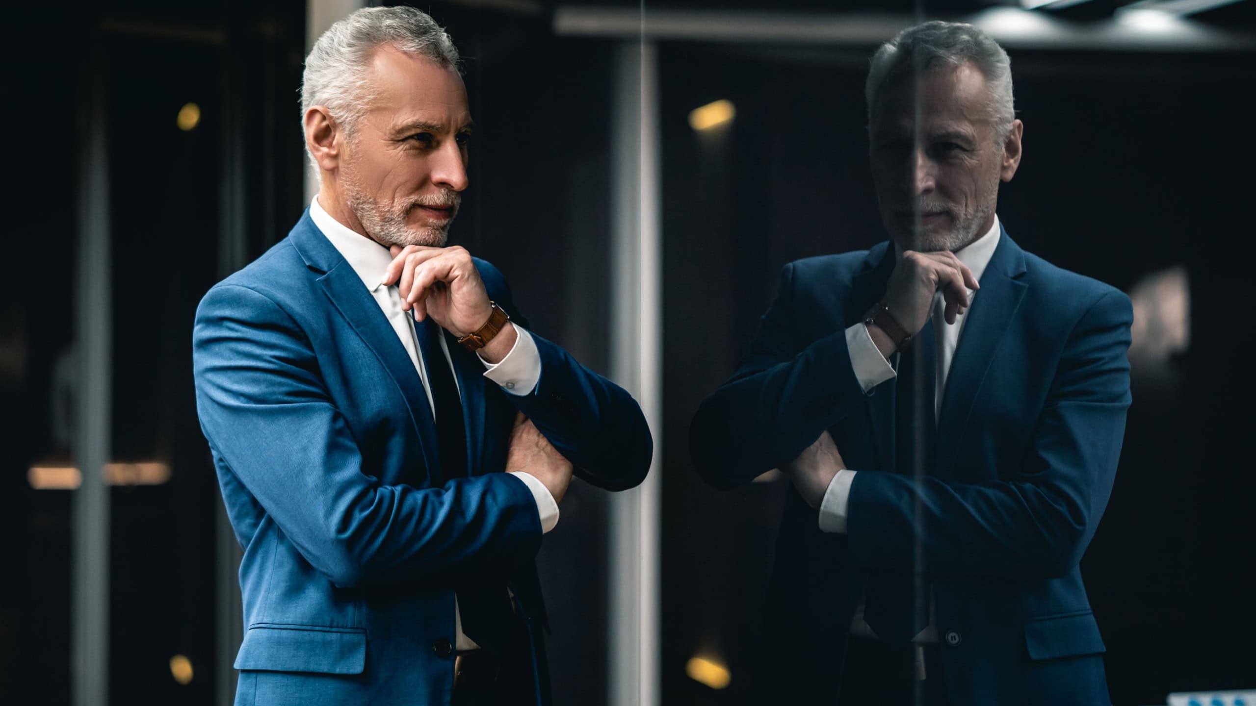 The mature businessman standing indoor