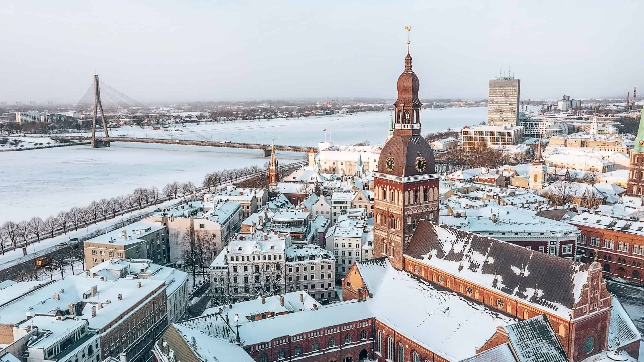 Aerial panorama view of Riga old town during beautiful winter day in Latvia. Freezing temperature in Latvia. White Riga.
