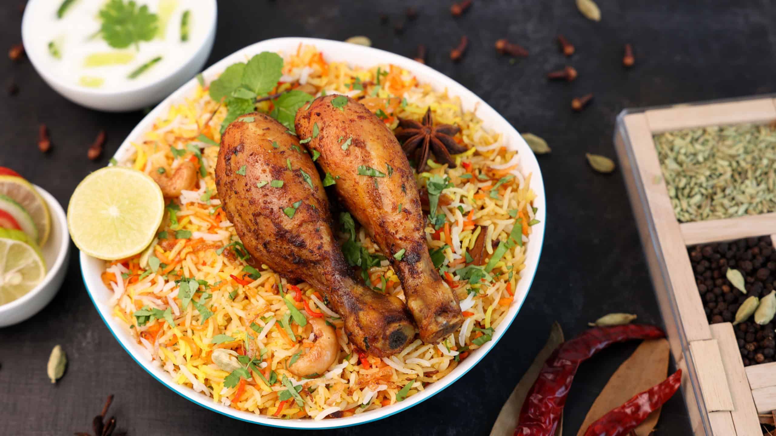 Chicken biryani Spicy Indian Malabar biryani Hyderabadi biryani, Dum Biriyani pulao golden bowl Kerala India Sri Lanka Pakistan basmati rice mixed rice dish with meat curry Ramadan Kareem, Eid