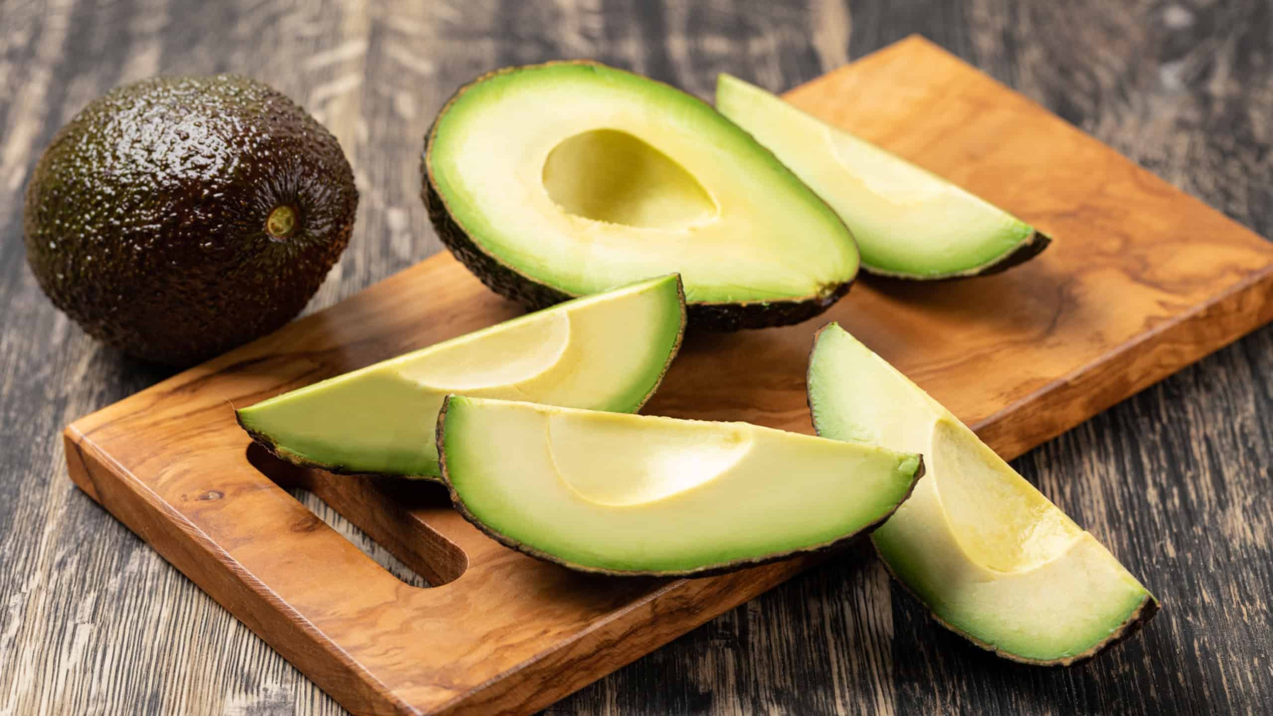 Avocado isolated on a wooden table