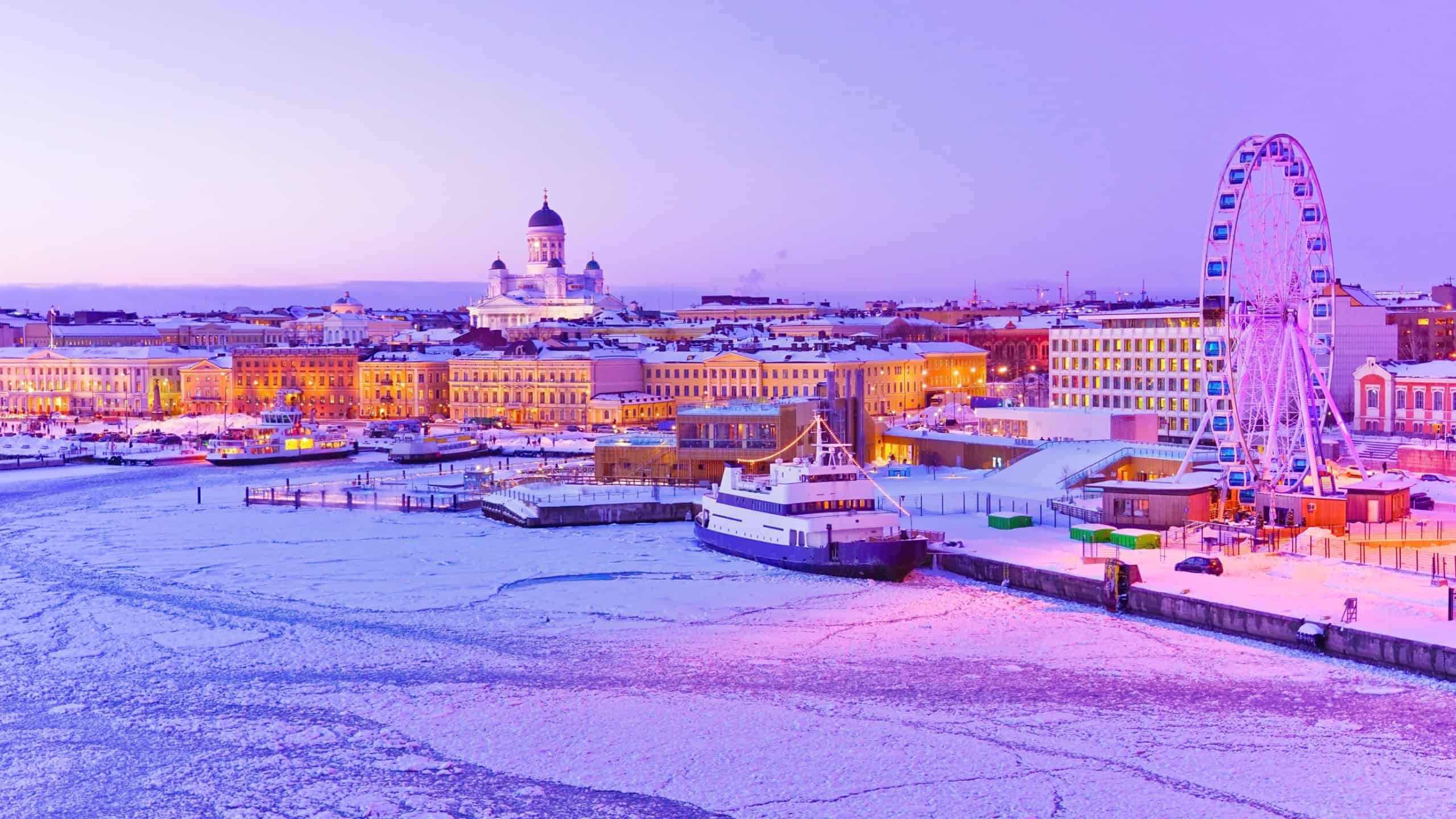 View of the icy harbor at dusk in winter in Helsinki, Finland.
