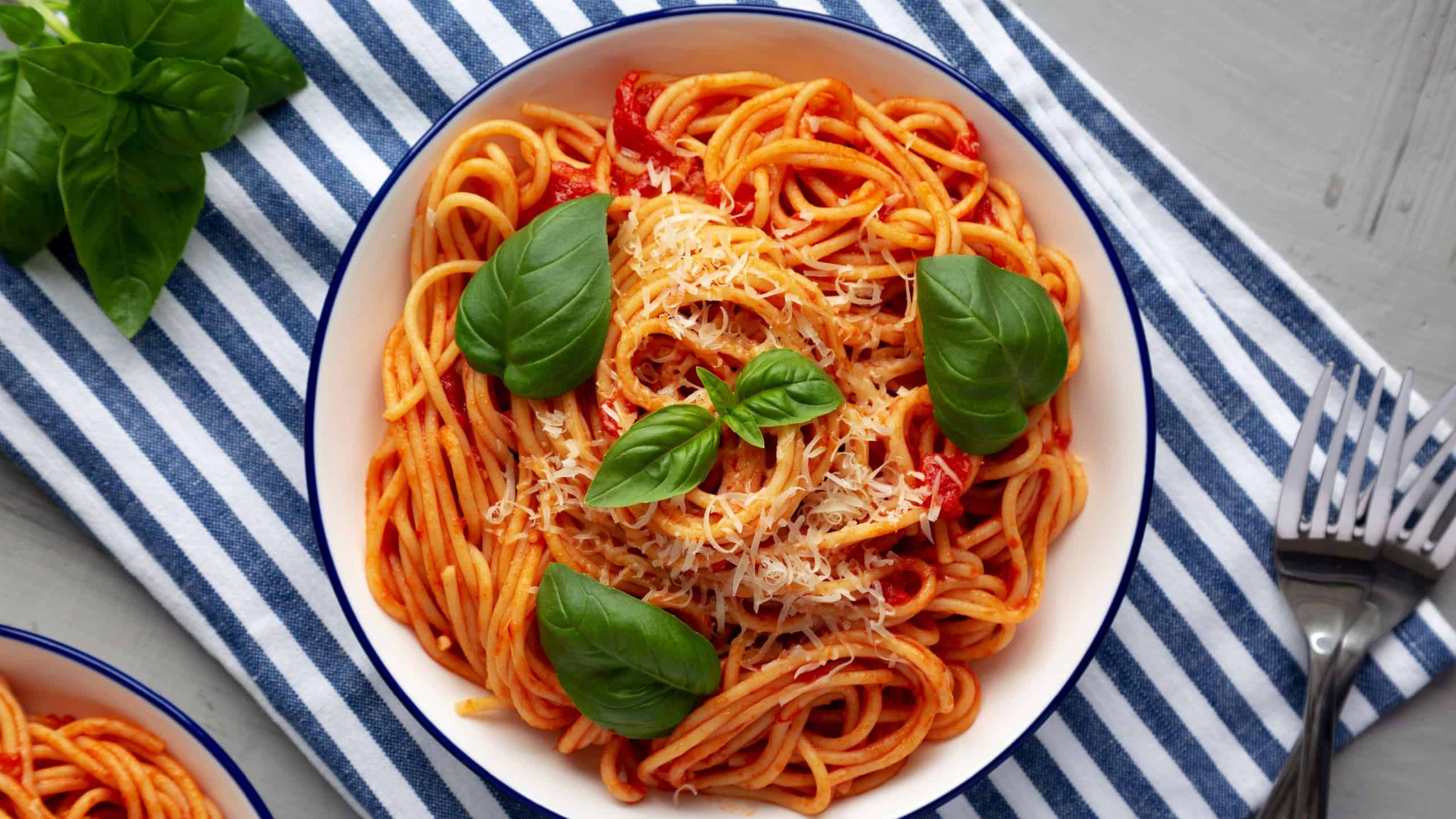 Homemade Pasta Pomodoro on a Plate, top view. Flat lay, overhead, from above.