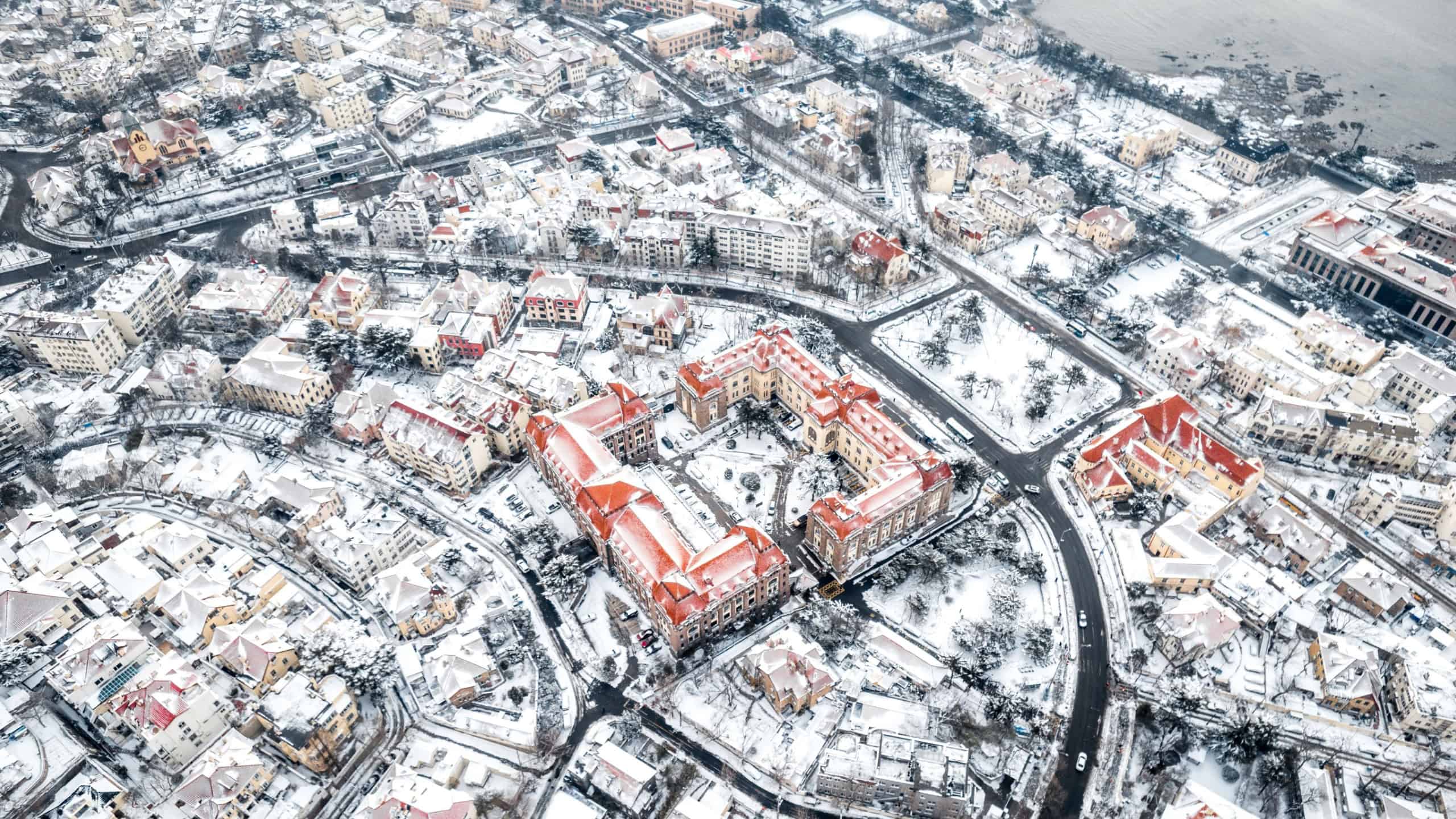 An Aerial shot of Qingdao City Snow Scene in Winter, China