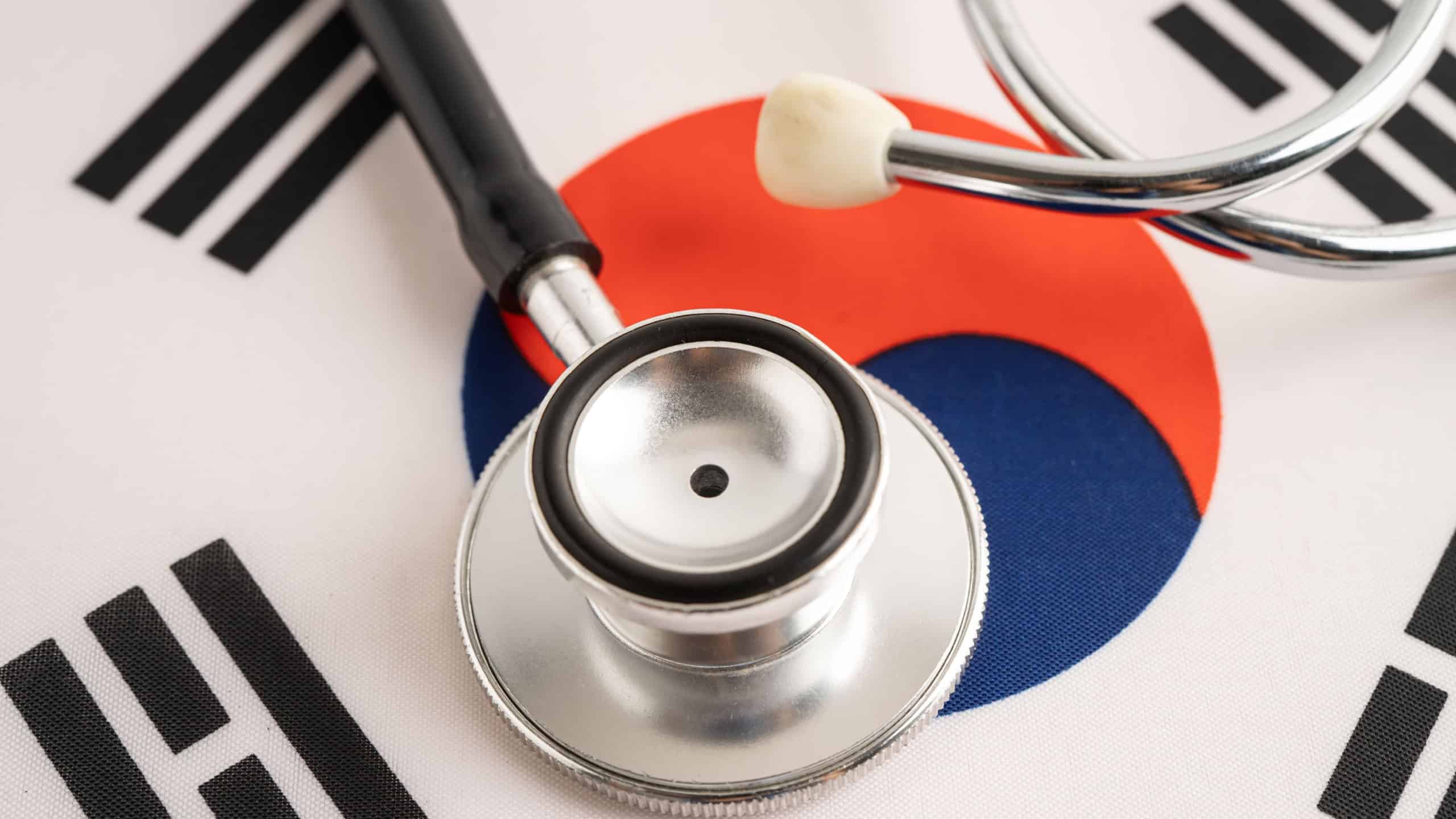 Stethoscope on South Korea flag, Business and finance.