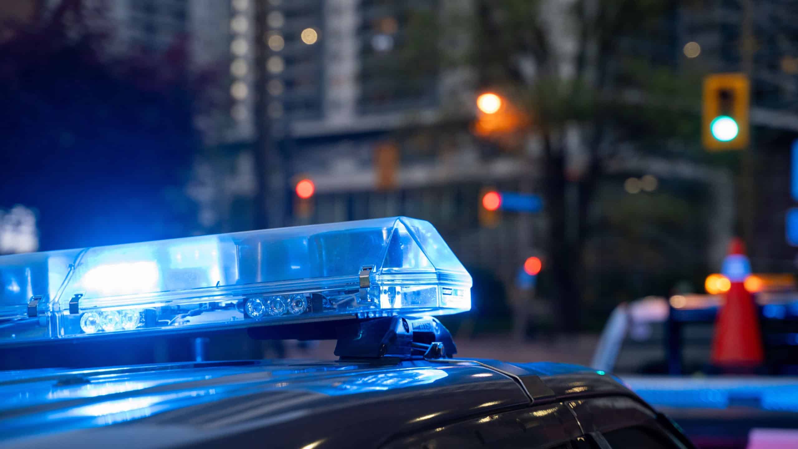 Close up of police car emergency lights at night.