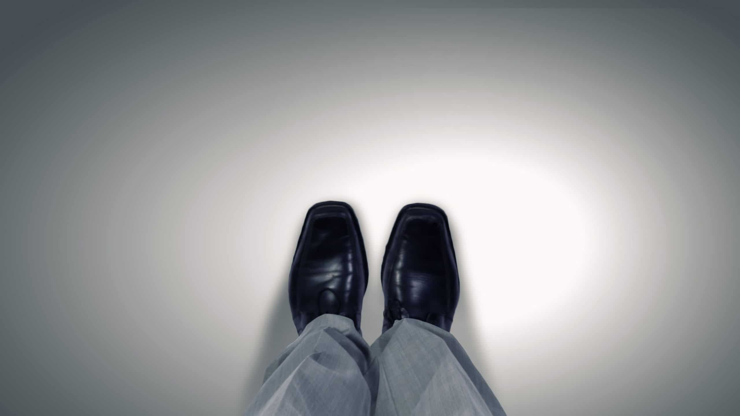 Top view of businessman legs choosing his way