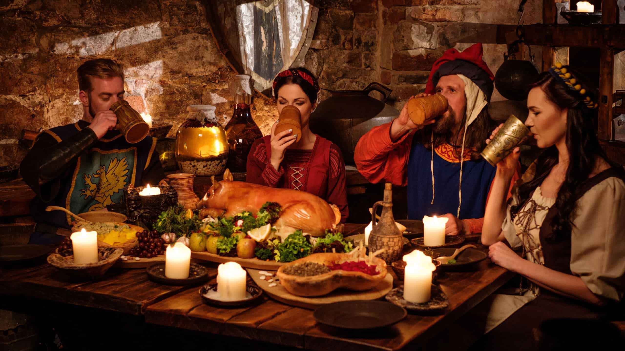 Medieval people eat and drink in ancient castle kitchen interior.