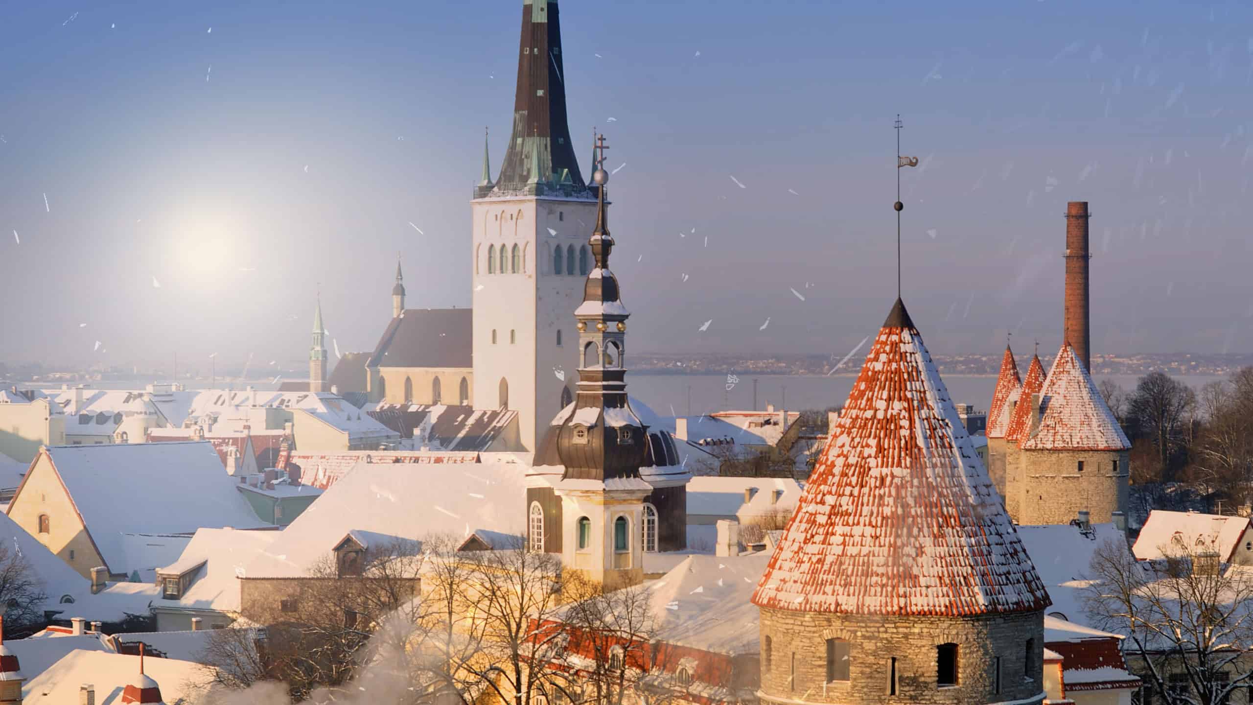 An amazing winter day eve Christmas in Tallinn - Estonia, panorama city during the snowfall, New Year background