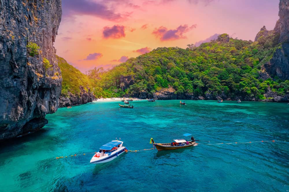 Aerial view of Nui beach and long tail boat in Phi Phi Don island, Krabi. Concept beauty nature of Thailand, travel Phuket.