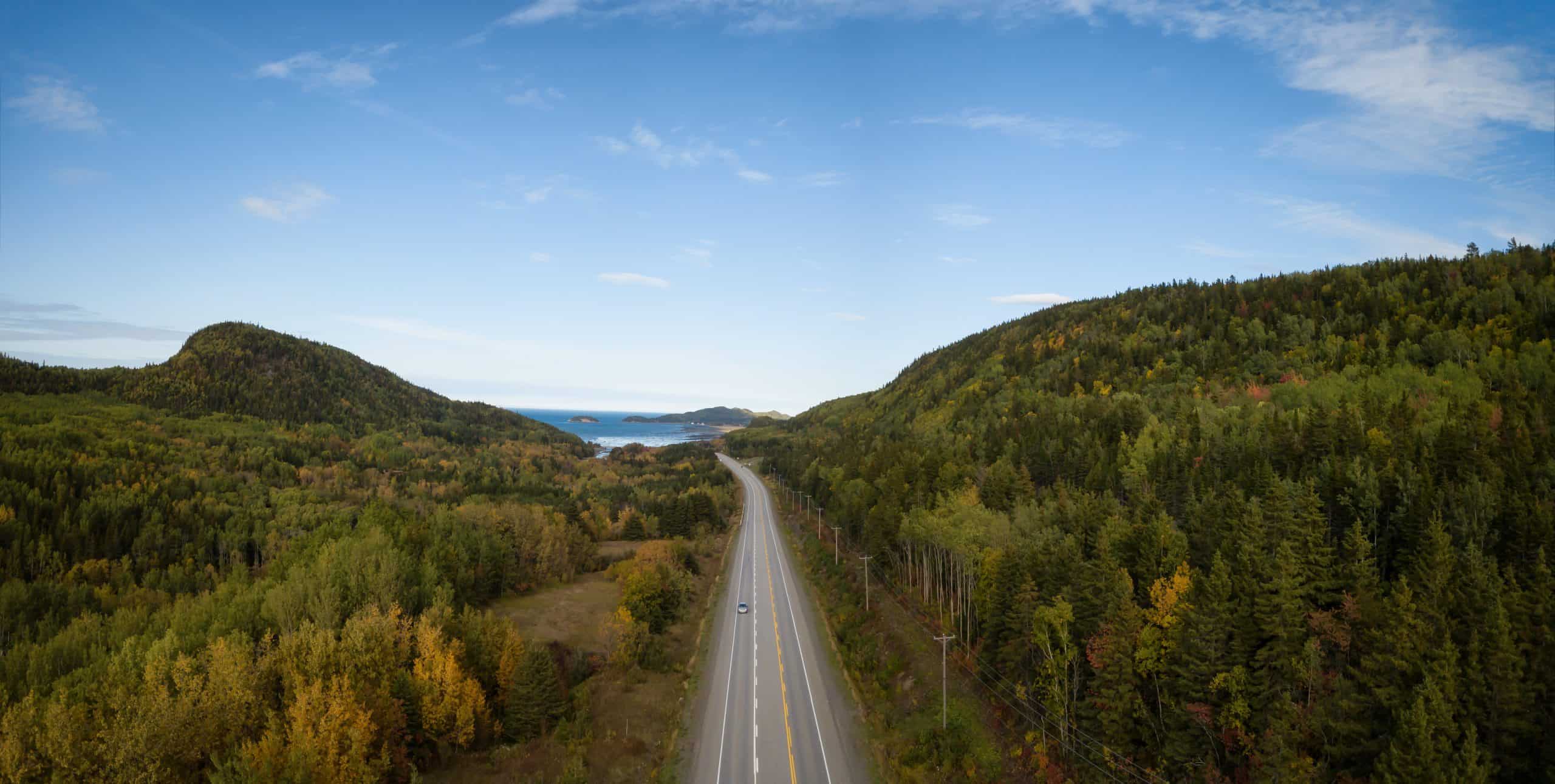 Aerial panoramic landscape view of Bic National Park during a vibrant sunny day. Taken in Le Bic, Rimousky, Quebec, Canada.